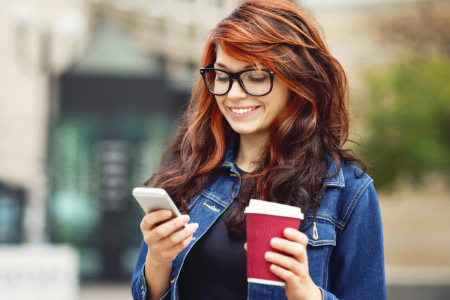 red-girl-with-mobile-and-coffee