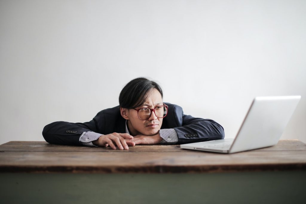 a lazy guy next to laptop