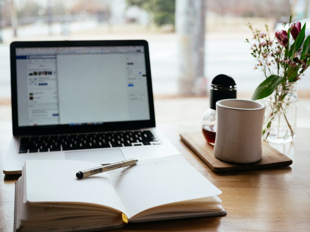 a laptop and notebook