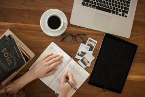 a girl writing in a journal