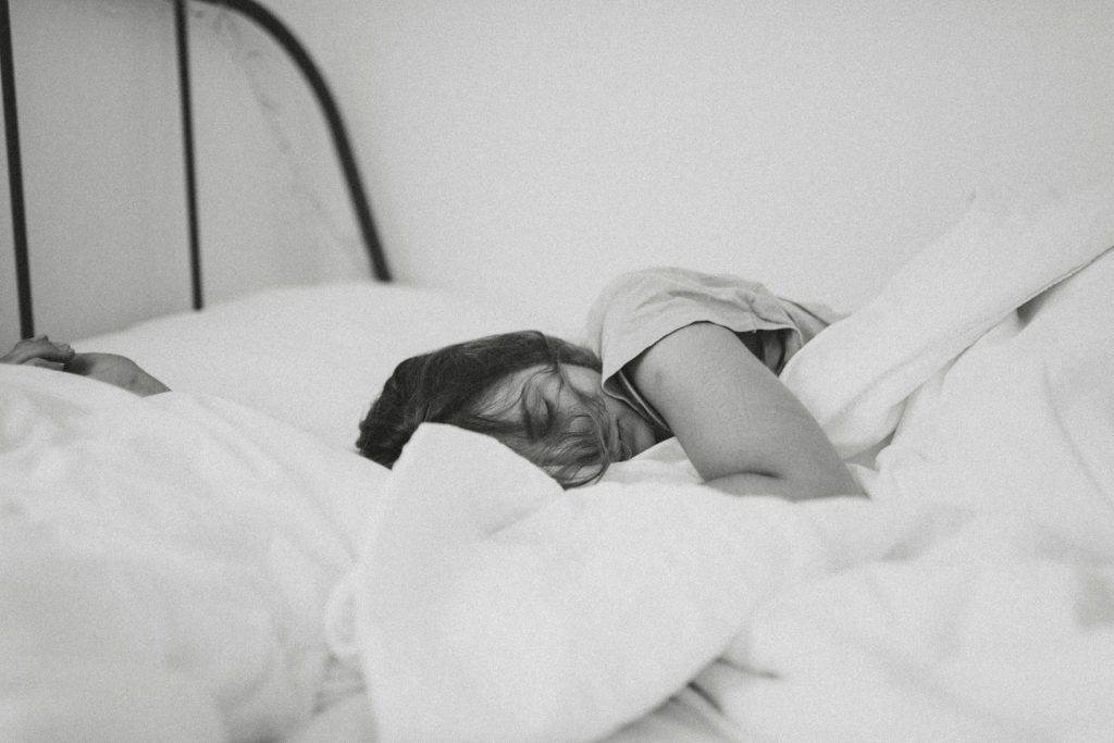 a girl in bed sleeping